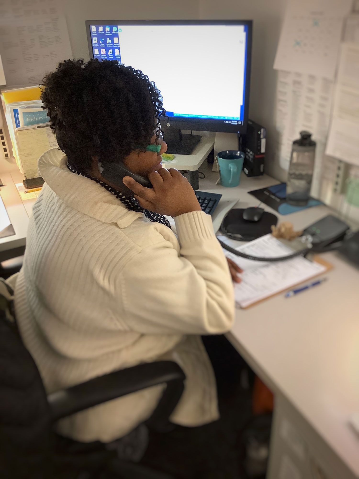 Woman on the phone talking to client